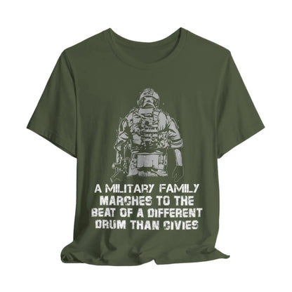 Military green t-shirt featuring a soldier with the text 'Military family marches to a different drum' representing strength and pride.