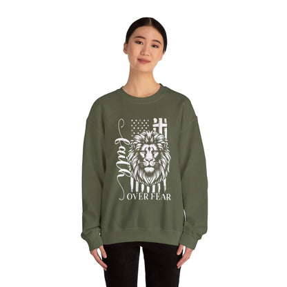 Lady in military green Faith Over Fear sweatshirt with message for strength and courage