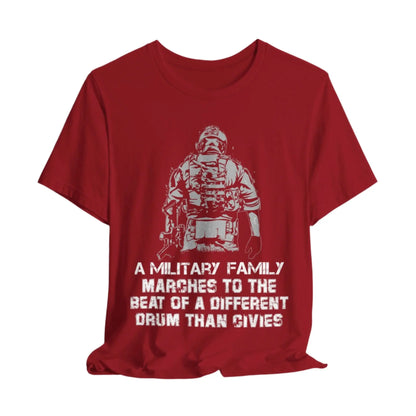 Canvas Red t-shirt featuring a soldier with the text 'Military family marches to a different drum' representing strength and pride.