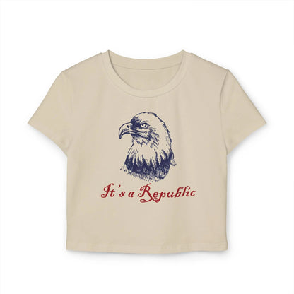 Sand baby tee crop top with eagle design and "It's A Republic" text.