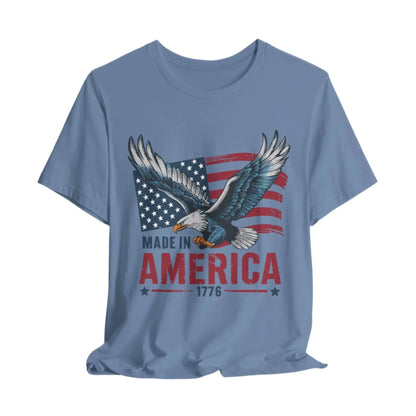 Steel Blue eagle and flag design on a t-shirt with the text 'Made in America 1776' symbolizing patriotism and freedom.