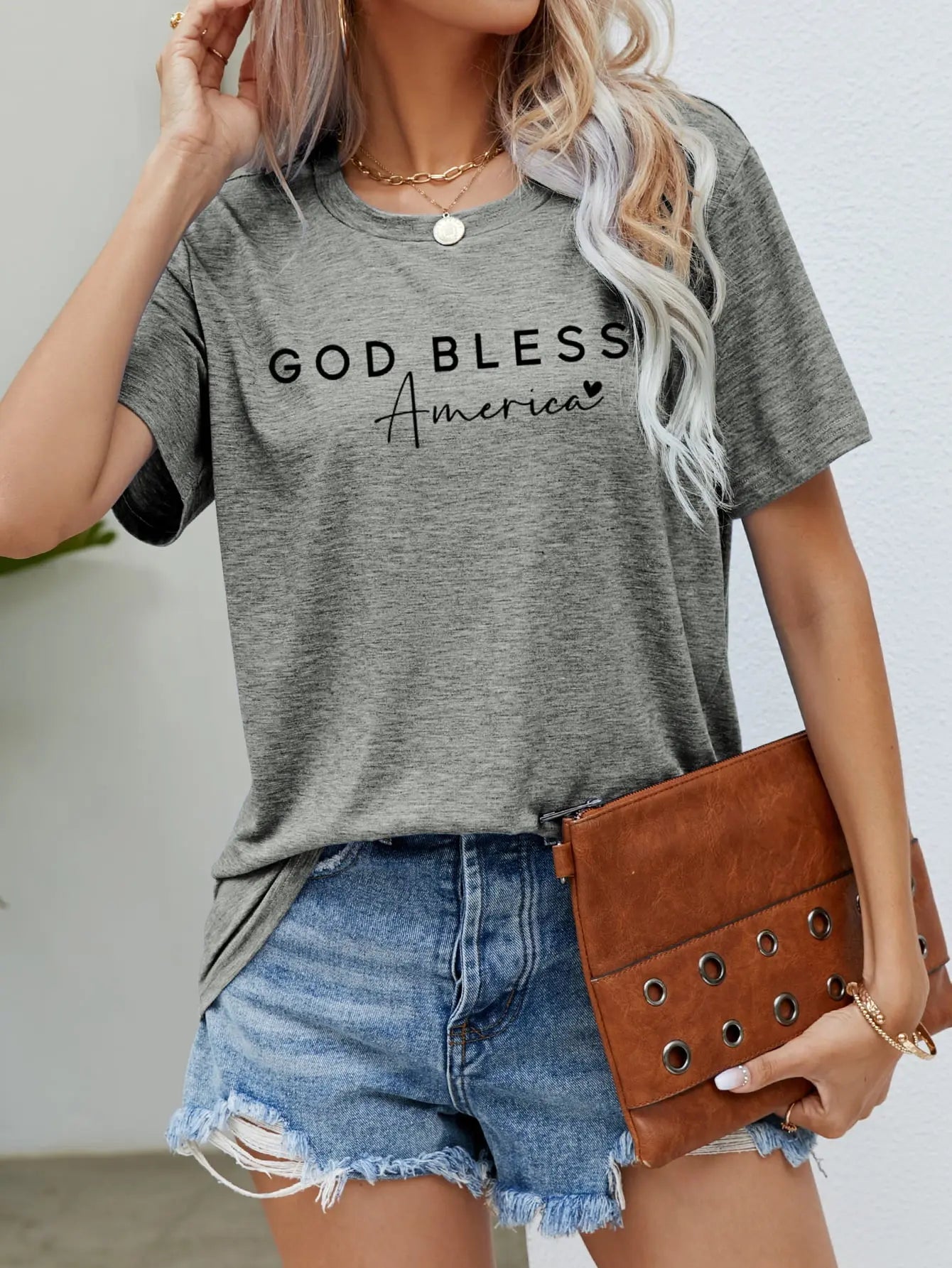 Gray God Bless America Graphic Short Sleeve Tee with bold patriotic design, breathable fabric, and a comfortable fit for stylish everyday wear.