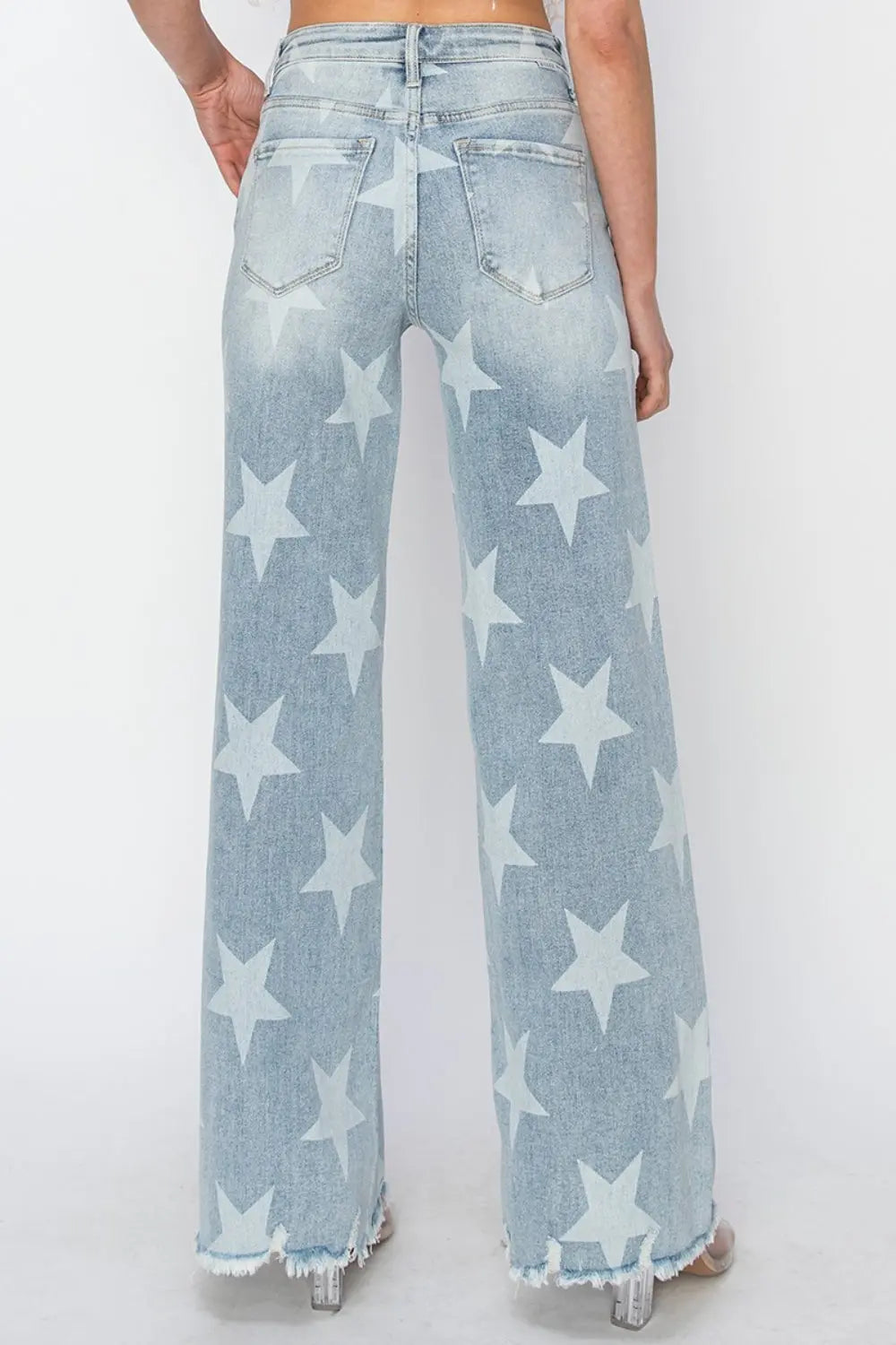 Back angle Full Size Raw Hem Star Wide Leg Jeans with trendy star accents, edgy raw hem, and flattering wide-leg fit for bold, stylish look.