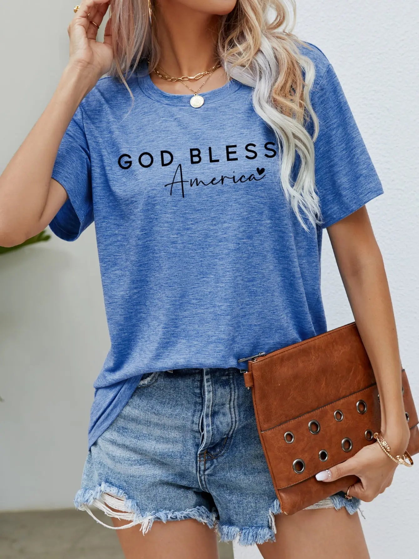 Cobalt Blue God Bless America Graphic Short Sleeve Tee with bold patriotic design, breathable fabric, and a comfortable fit for stylish everyday wear.