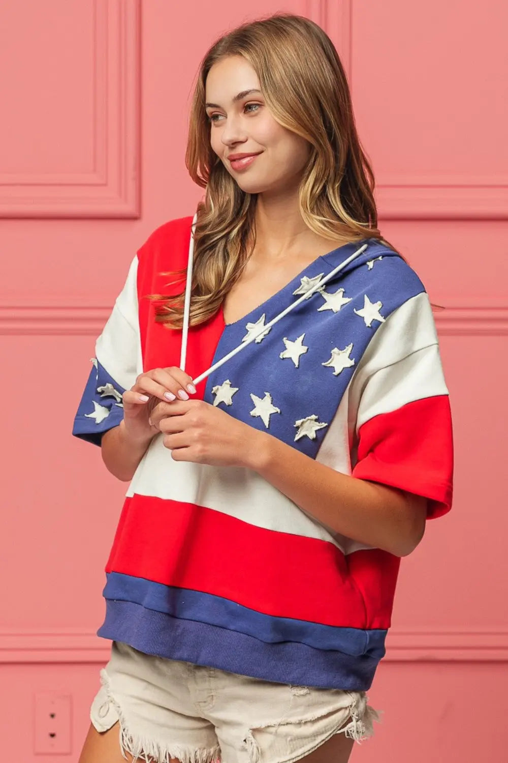 Lady wearing Forever America Flag Theme Hoodie, bold patriotic design, cozy fit, and durable fabric, perfect for showcasing your American pride.