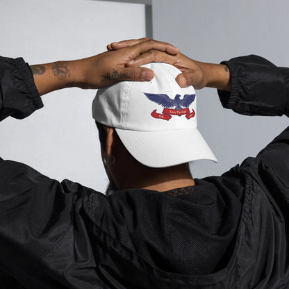 Nan wearing White embroidered baseball cap text We The People on left side Envy The Eagle™ Logo embroidered on front. Patriotism Love for Country