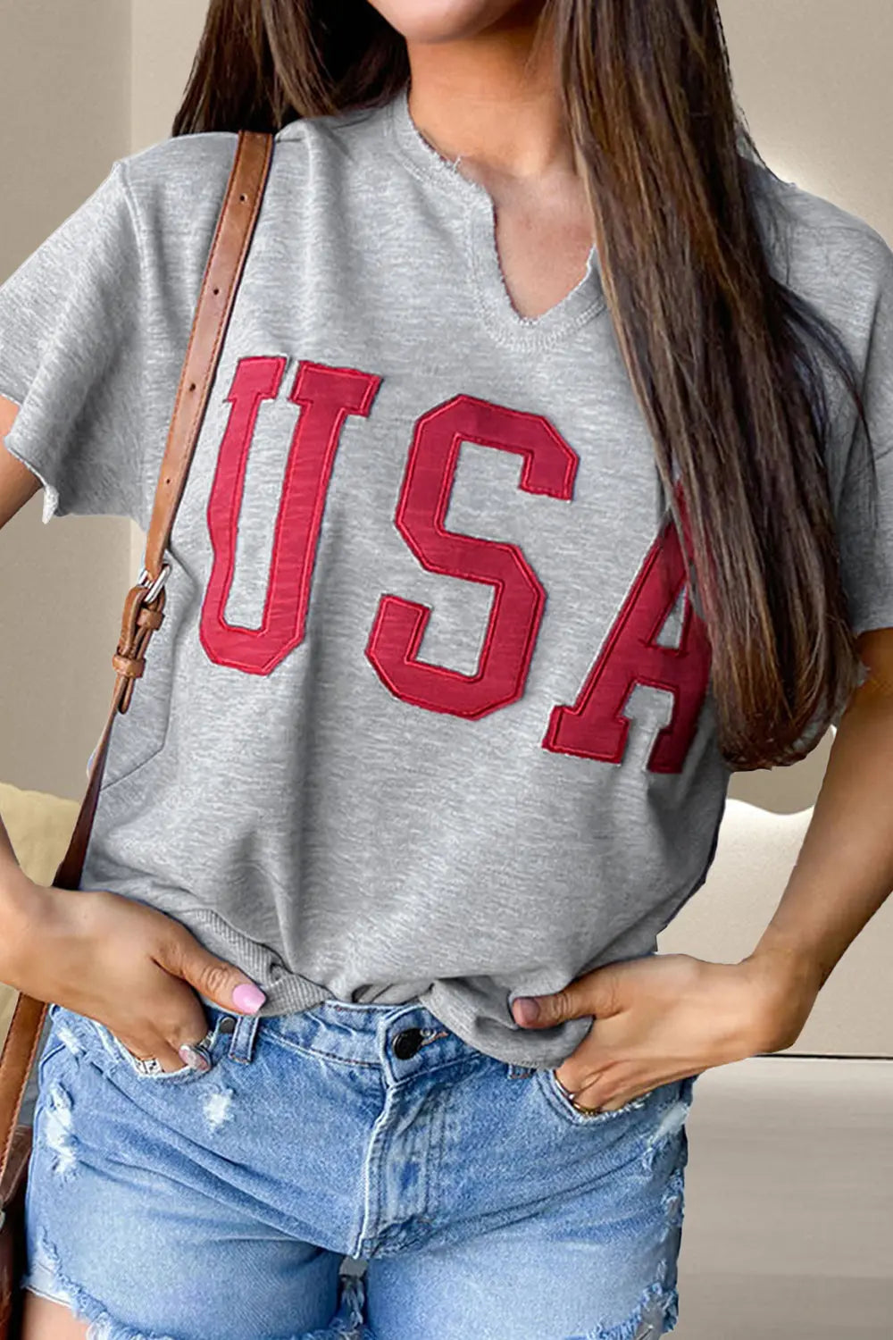 Lady wearing Top Notch USA Notched T-Shirt with unique neckline, soft fabric, and stylish patriotic design for casual comfort and bold flair.